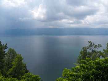 Scenic view of lake toba against sky