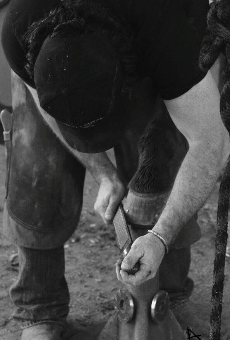 MIDSECTION OF MAN WORKING AT CAMERA