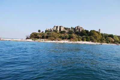 Scenic view of sea against clear blue sky