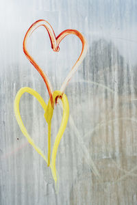 Hand drawn hearts on transparent plexiglass