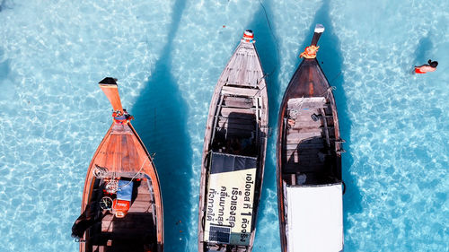 High angle view of commercial dock against blue sea