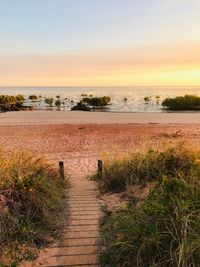 Scenic view of lake against sky during sunset