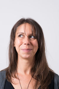 Portrait of a serious young woman over white background