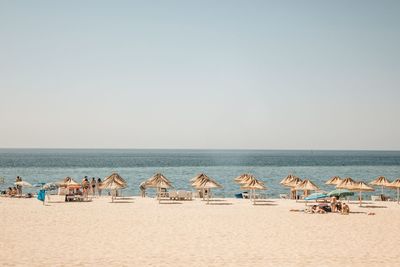 Scenic view of beach against clear sky