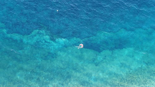 High angle view of two people in sea