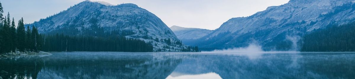 Panoramic view of lake and snowcapped mountains against sky