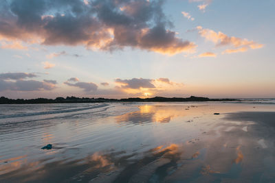 Scenic view of sea against sky at sunset