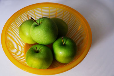 High angle view of apples in basket on table