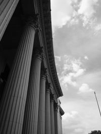 Low angle view of historical building against cloudy sky