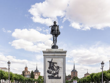 Statue of a building against cloudy sky