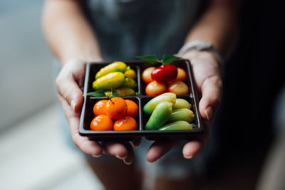 Close-up of hand holding vegetables