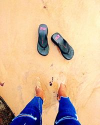 Low section of people standing on sand