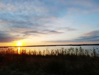 Scenic view of sea against sky during sunset