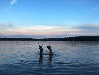 Scenic view of lake against sky during sunset