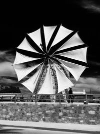 Umbrella against sky at night