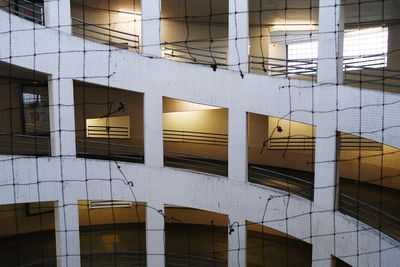 Parking lot building seen through broken net