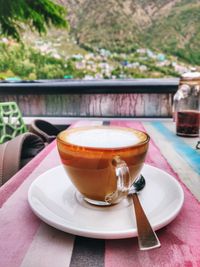 Close-up of coffee cup on table