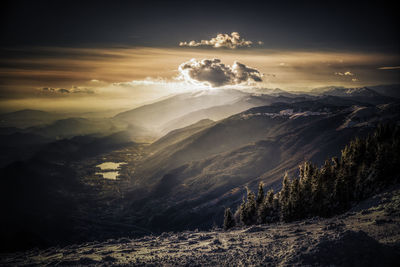 Aerial view of landscape against sky at sunset