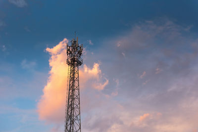 Low angle view of communications tower against sky