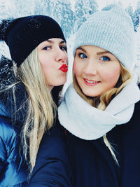 Portrait of a smiling young woman in snow