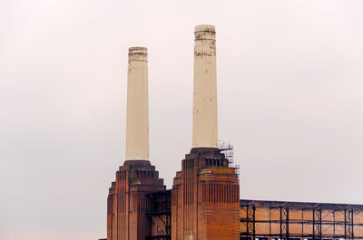 Low angle view of factory against clear sky