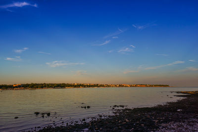 Scenic view of sea against sky at sunset