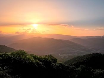 Scenic view of mountains against sky during sunset