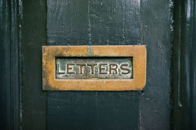 Close-up of text on door