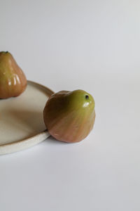 Close-up of fruits against white background