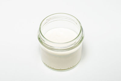 High angle view of glass jar on white background