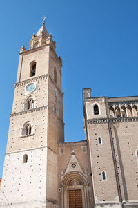 Low angle view of historic church building in chieti against clear blue sky