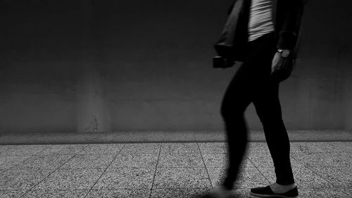 Low section of man standing on floor