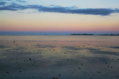 Scenic view of sea against sky at sunset