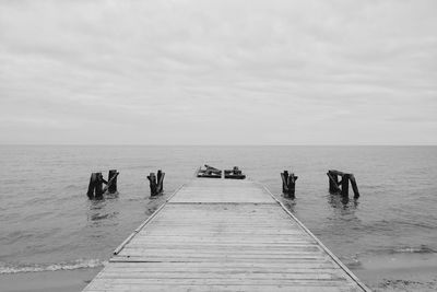 Pier over sea against sky