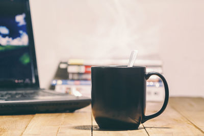 Close-up of coffee cup on table
