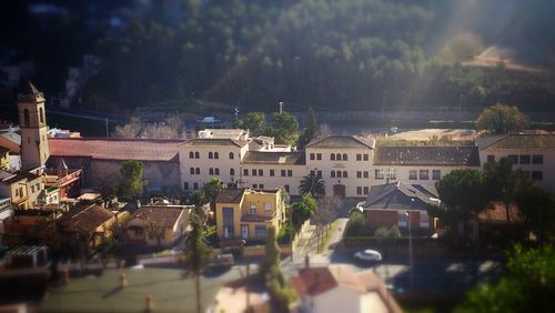 High angle view of buildings and trees in city