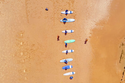 Directly above shot of multi colored umbrellas on sand