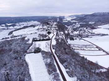 High angle view of snowcapped mountain against sky