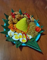 High angle view of fruits in plate on table