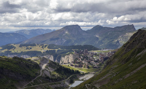 Scenic view of landscape and mountains against sky