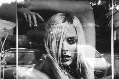 Reflection of woman on car window