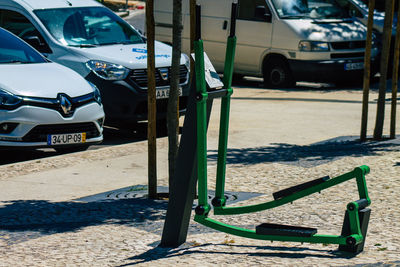 Cars parked on street during sunny day