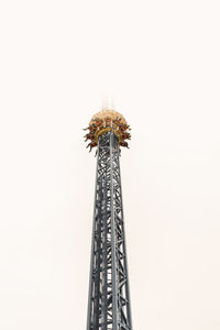 Low angle view of ferris wheel against clear sky