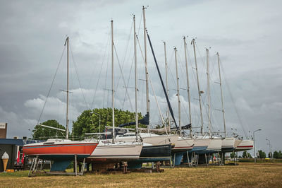 Sailboats collected in brackets for repair in drimmelen. a small hamlet with harbor in netherlands.