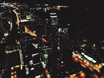 High angle view of illuminated buildings in city at night