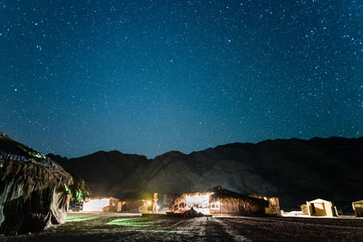 Scenic view of mountains against sky at night