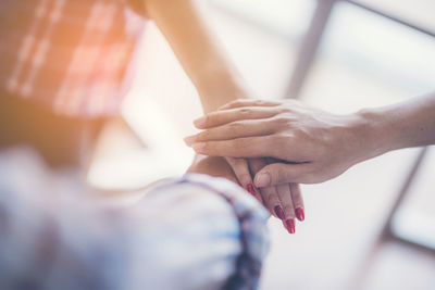 Close-up of couple holding hands