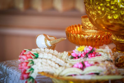 Close-up of religious offerings in temple