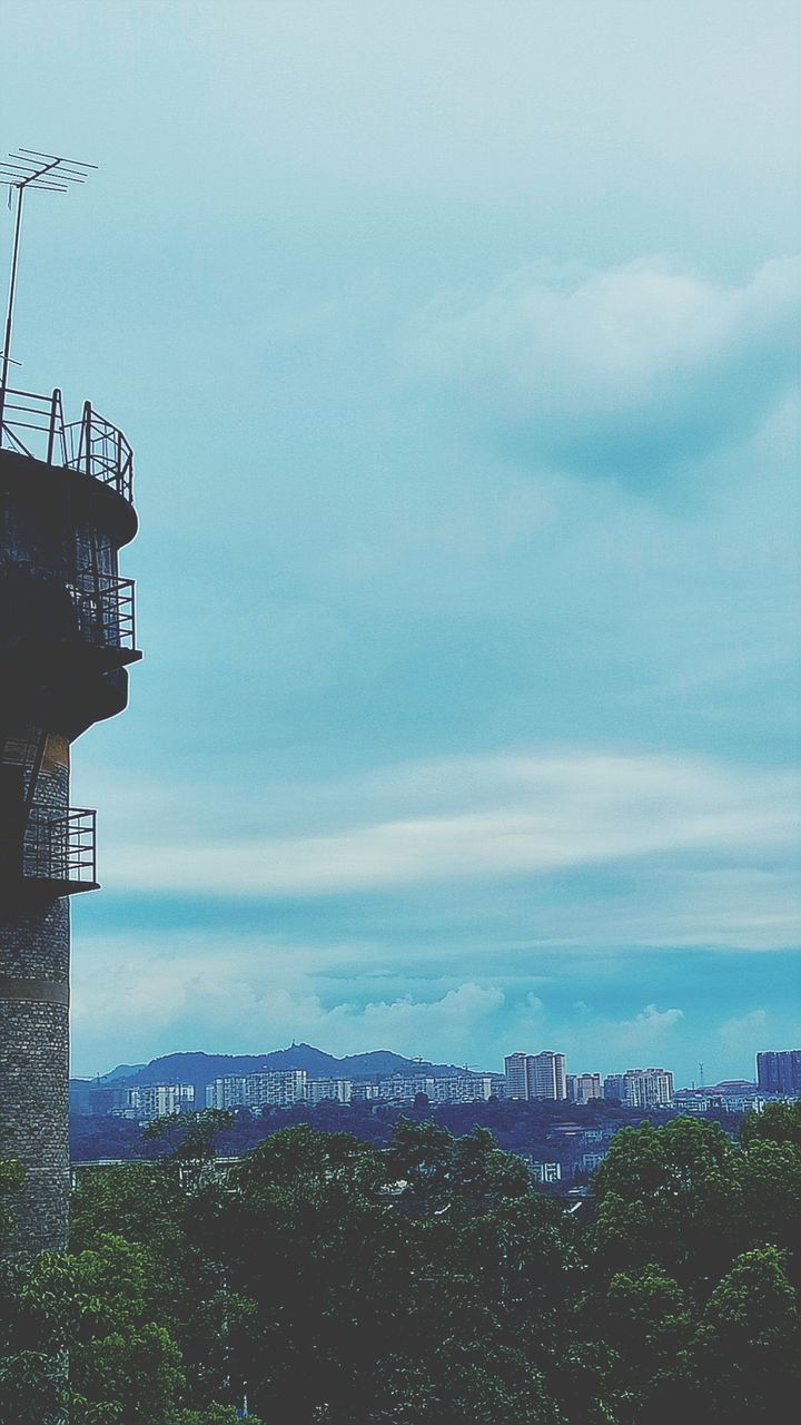 AERIAL VIEW OF CITY AGAINST CLOUDY SKY