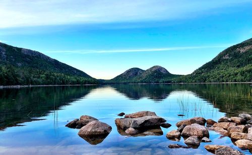 Scenic view of lake against blue sky